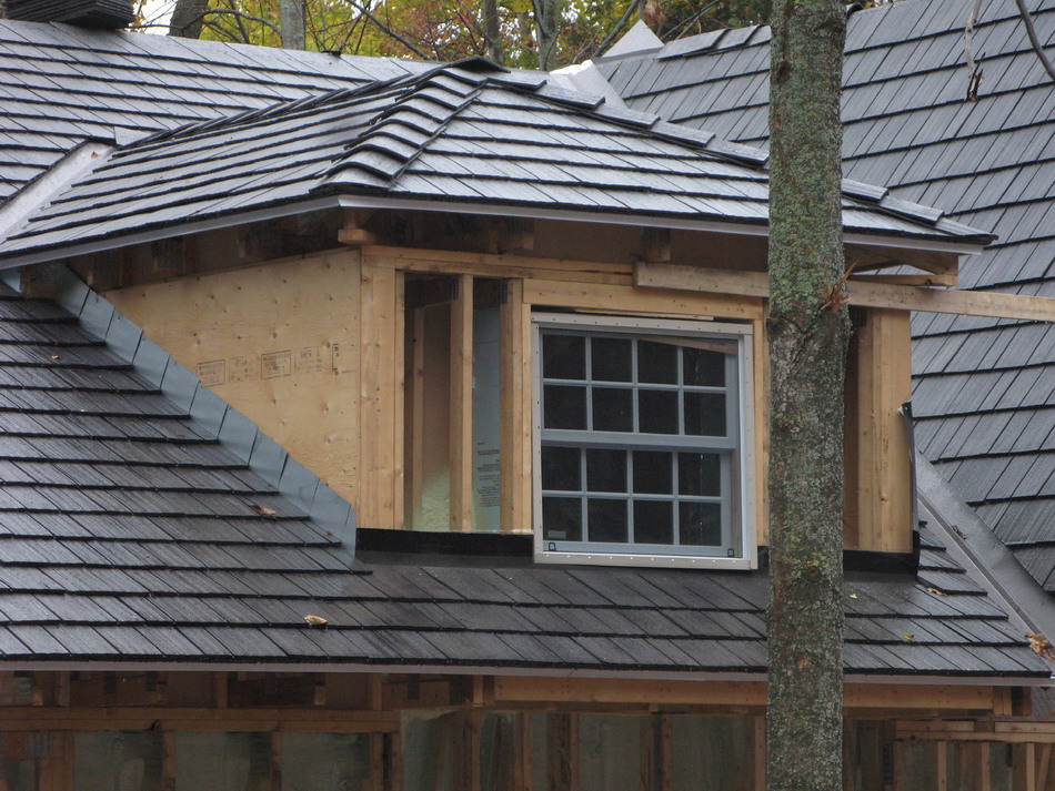 View of dormer and roof clad in Enviroshakes. Grey colour will turn light grey brown.