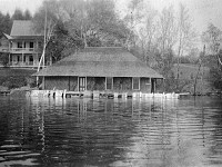 1918 View north from lake of Cedarhurst and boathouse (ice damaged)
